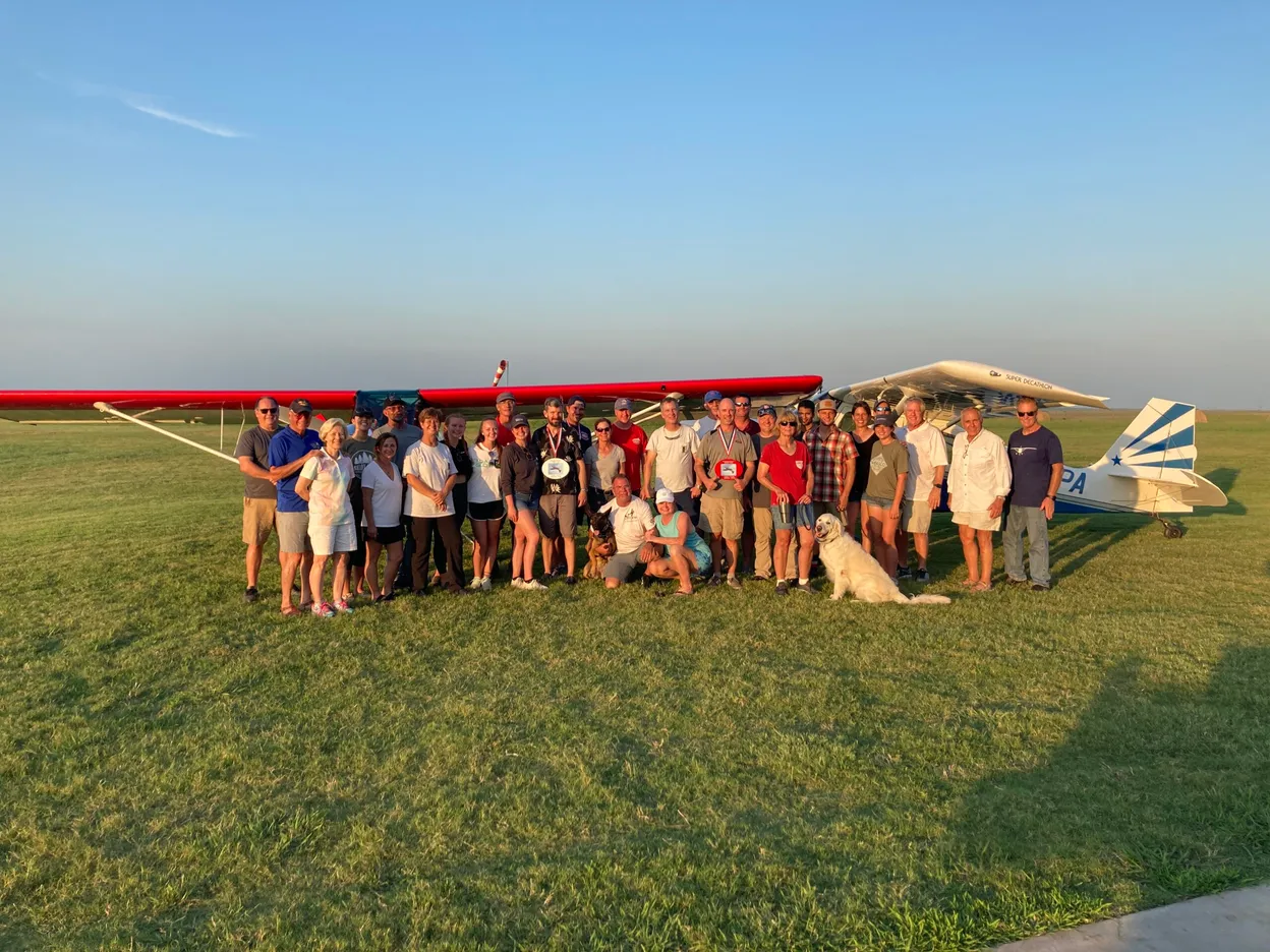 Aerobatic pilots gathered at a competition event